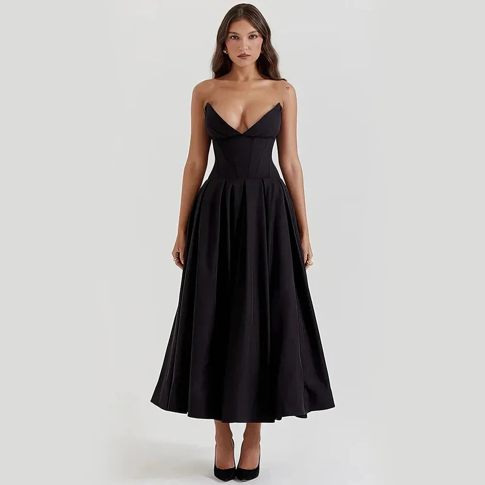 Elegant black maxi dress with spaghetti straps and backless design, perfect for formal occasions and turning heads
