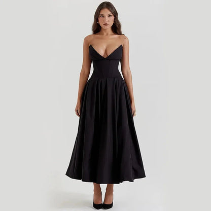 Elegant black maxi dress with spaghetti straps and backless design, perfect for formal occasions and turning heads