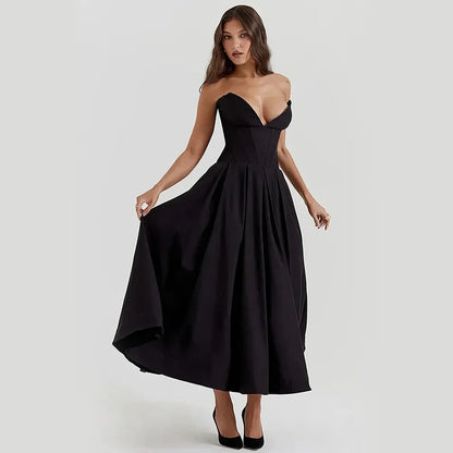 Elegant black maxi dress with spaghetti straps and backless design, perfect for formal occasions and turning heads