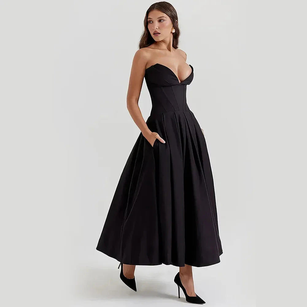 Elegant black maxi dress with spaghetti straps and backless design, perfect for formal occasions and turning heads