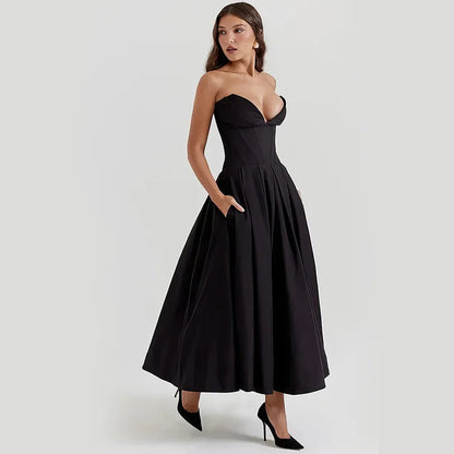 Elegant black maxi dress with spaghetti straps and backless design, perfect for formal occasions and turning heads