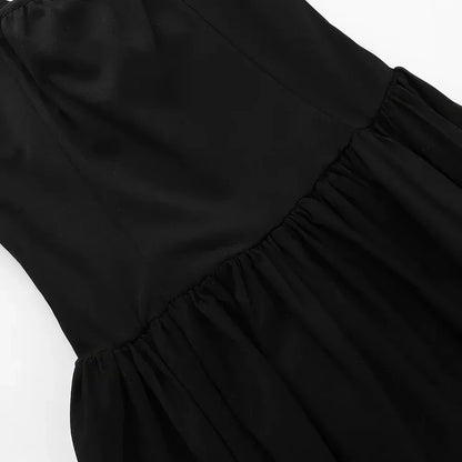 Elegant black maxi dress with spaghetti straps and backless design, perfect for formal occasions and turning heads
