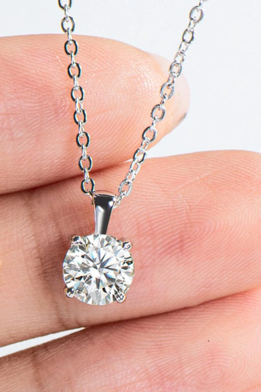 Sparkling 925 sterling silver necklace with a 1 carat moissanite center stone, showcasing a modern, minimalist chain-link design