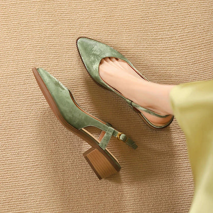 Elegant green leather slingback pumps with a 4cm square heel, perfect for the office or a night out.