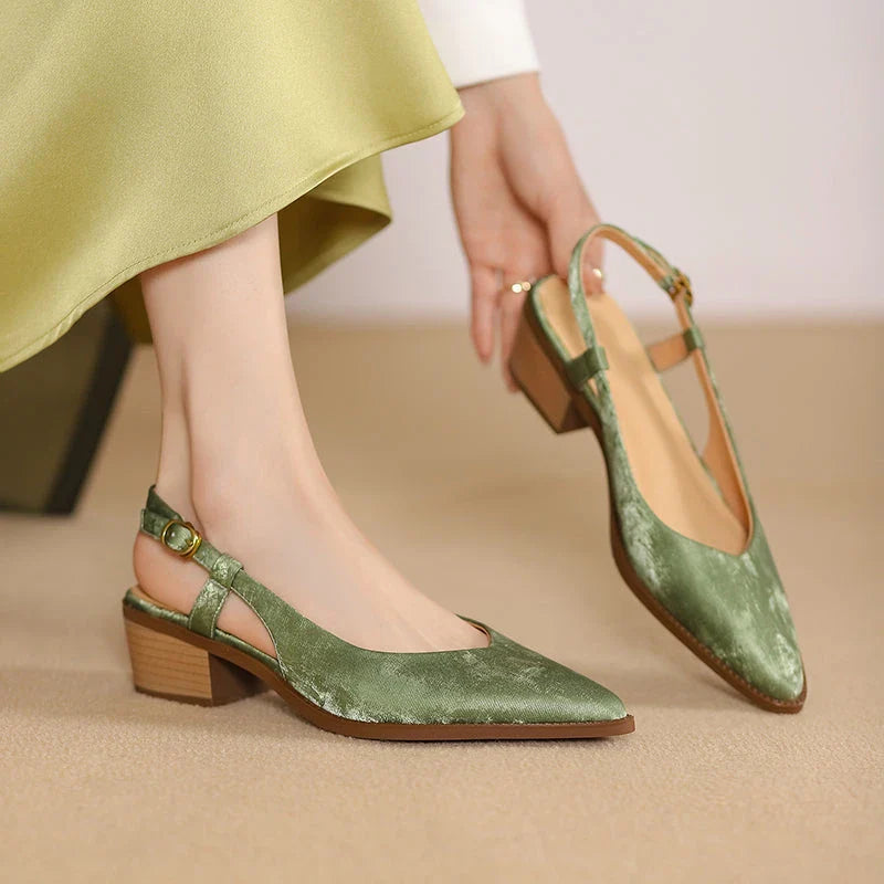 Elegant green leather slingback pumps with a 4cm square heel, perfect for the office or a night out.