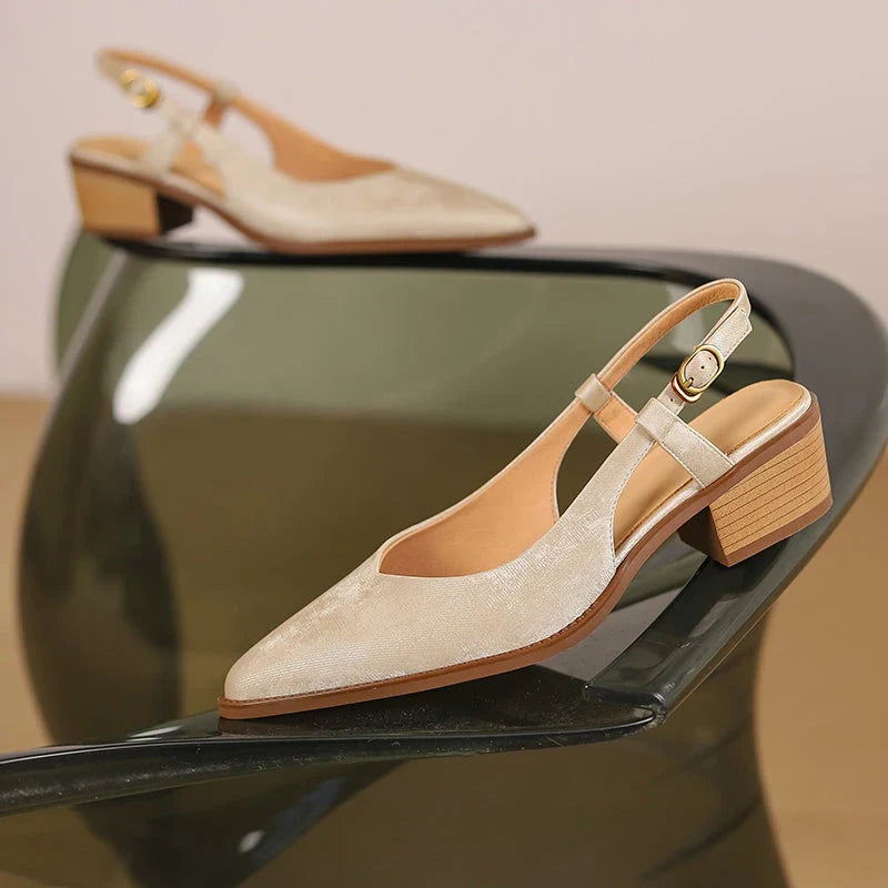 Elegant green leather slingback pumps with a 4cm square heel, perfect for the office or a night out.