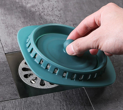 A durable and flexible floor drain cover that effectively seals in odors and allows for quick drainage.