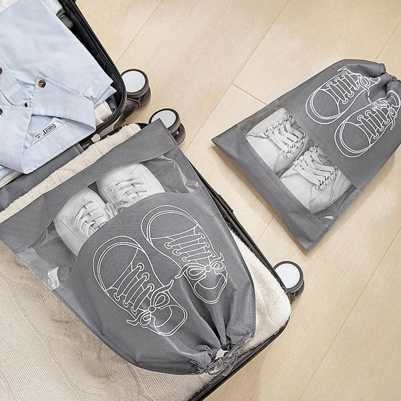 5-piece set of travel shoe storage organizer bags in gray color, featuring transparent front panels and a folding design for compact storage