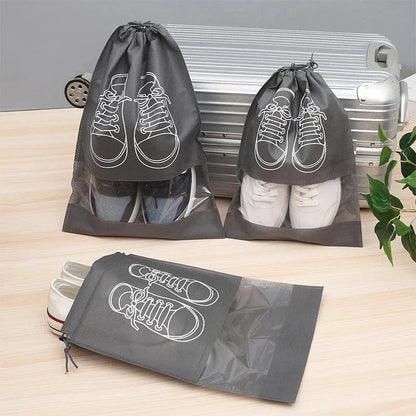 5-piece set of travel shoe storage organizer bags in gray color, featuring transparent front panels and a folding design for compact storage