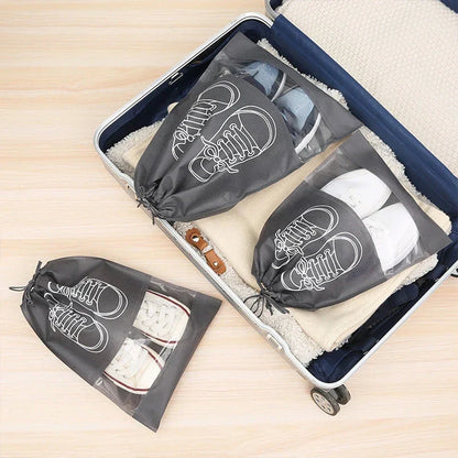 5-piece set of travel shoe storage organizer bags in gray color, featuring transparent front panels and a folding design for compact storage