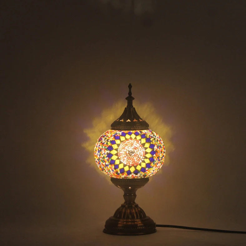 Glass table lamp with 150mm diameter shade and 330cm cord on wooden surface