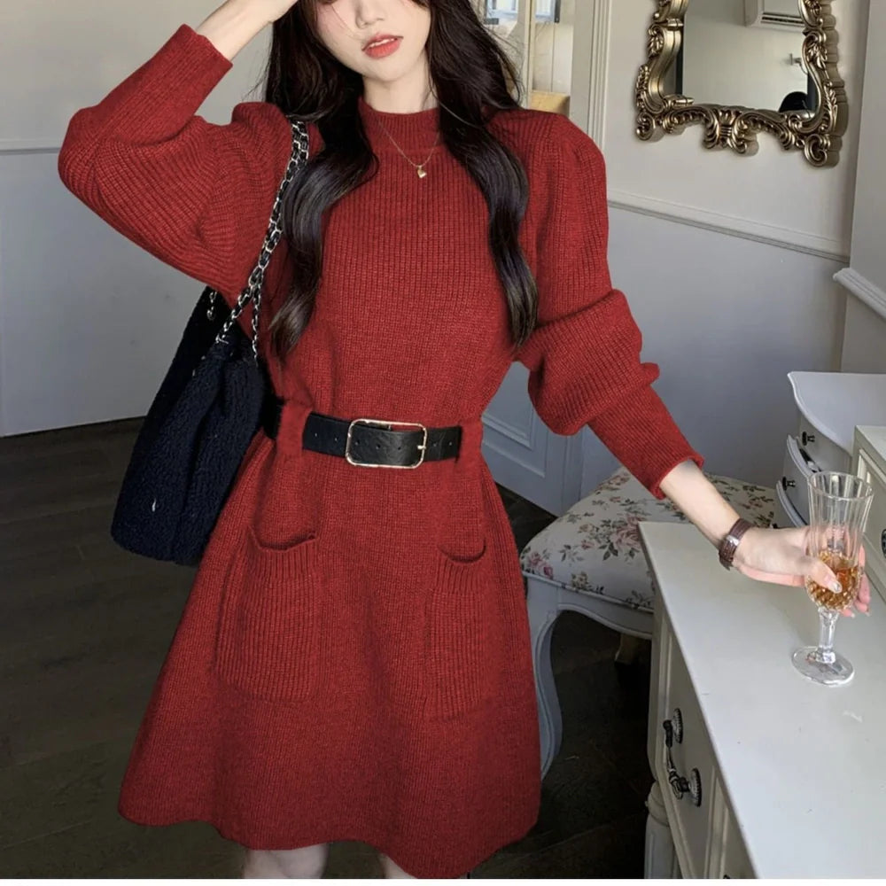 Women's long sleeve loose knitted dress in beige with black belt, showing high waist design and free size fit