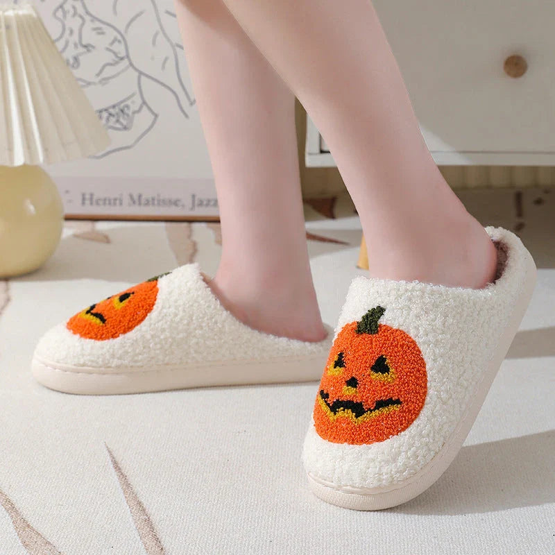 Pumpkin-shaped slippers in white and black colors, featuring a cozy cotton lining and non-slip rubber sole for comfortable indoor wear.