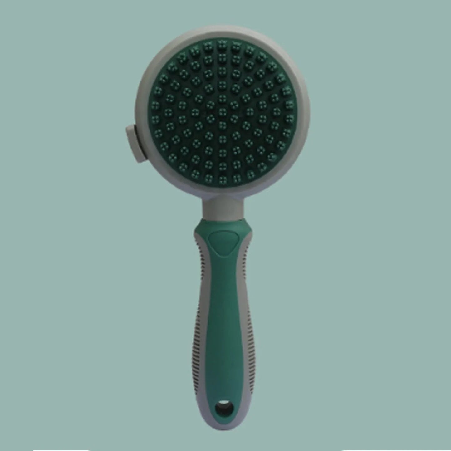 Pink double-sided cat brush with release button showing smooth brush side and flea comb side for grooming indoor cats