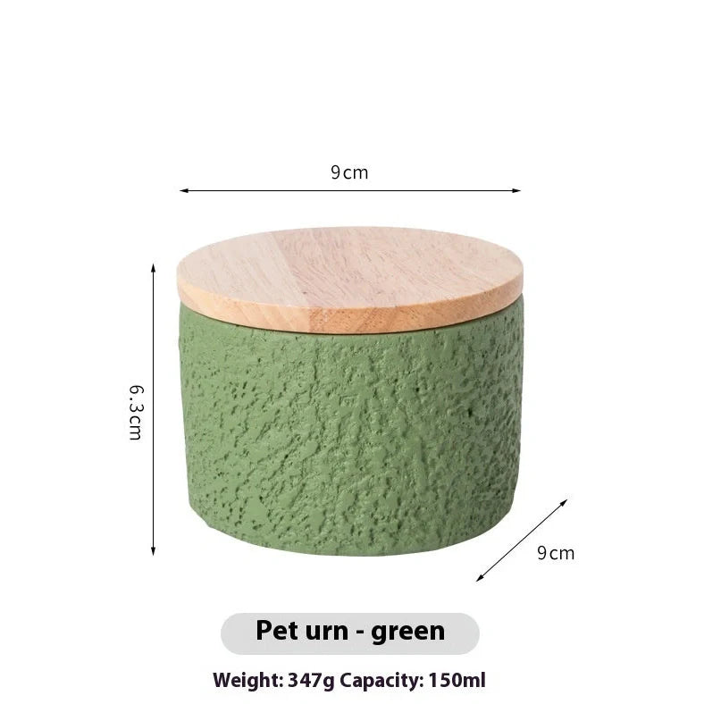 Handmade cement cinerary casket for pet ashes in six colours: black, grey, green, pink, white, yellow