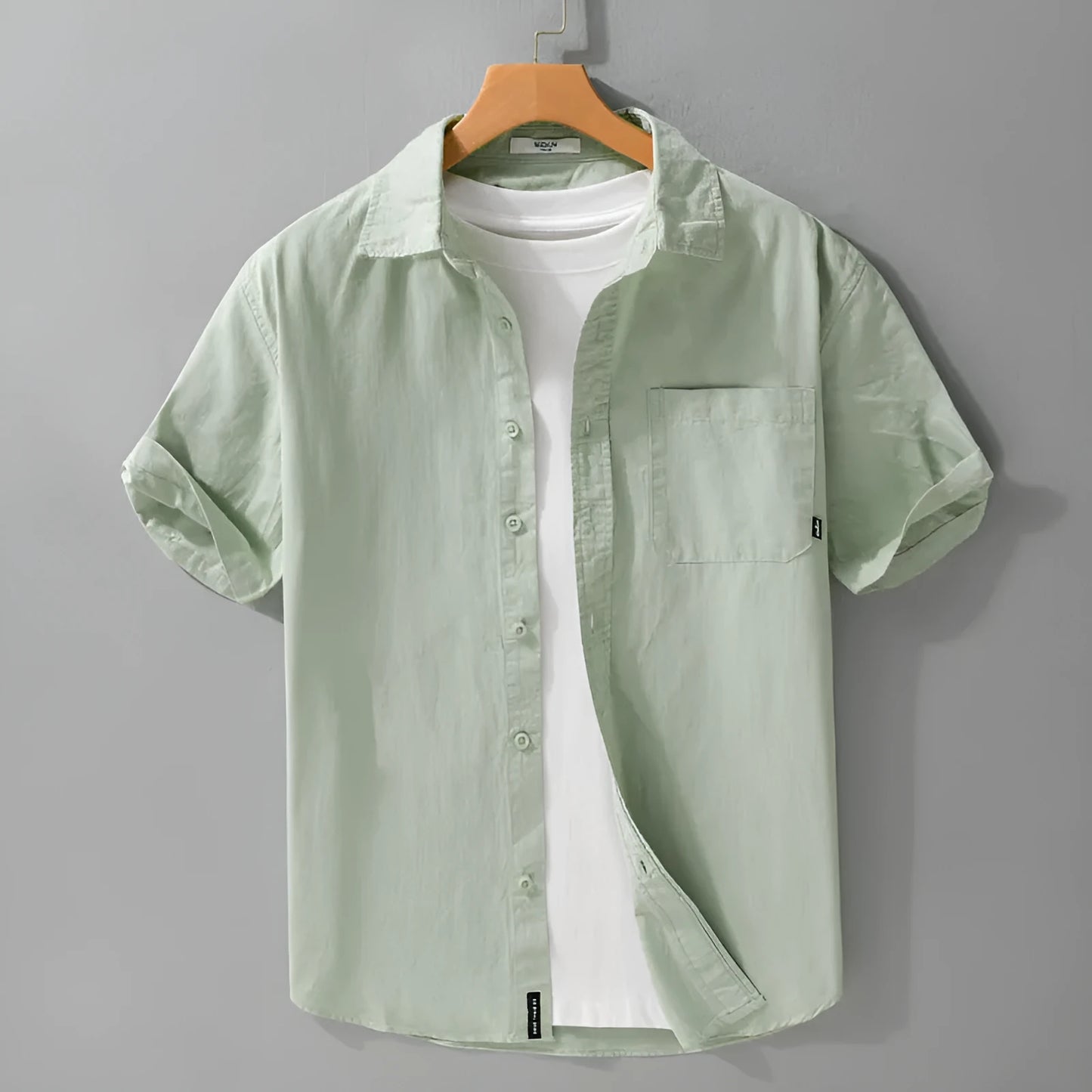 Men's loose fit pure cotton short sleeve shirt in cardigan style, shown in light blue.