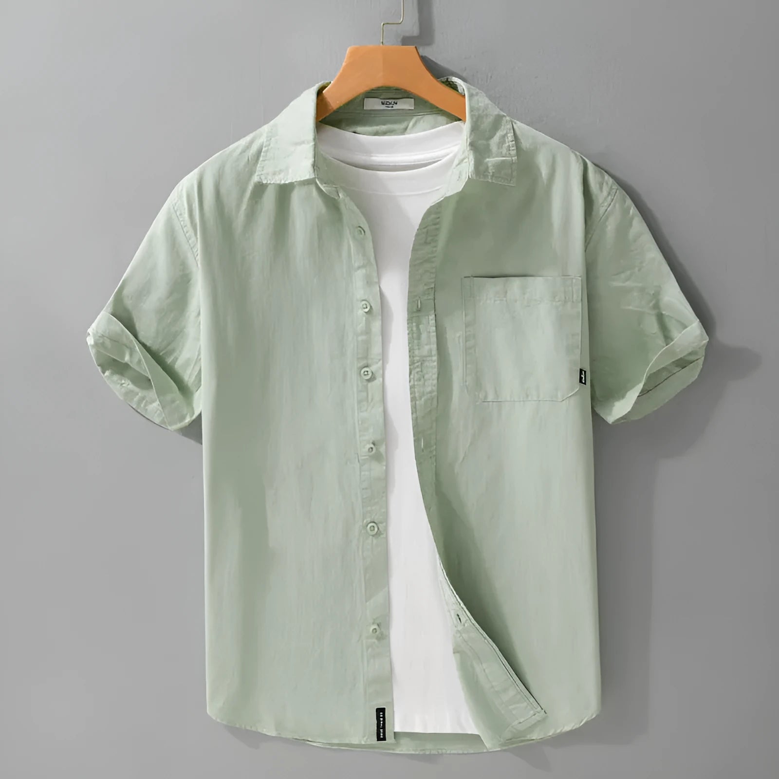 Men's loose fit pure cotton short sleeve shirt in cardigan style, shown in light blue.