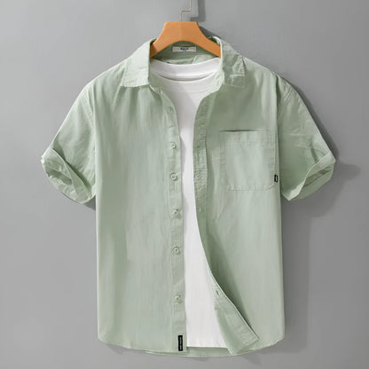 Men's loose fit pure cotton short sleeve shirt in cardigan style, shown in light blue.