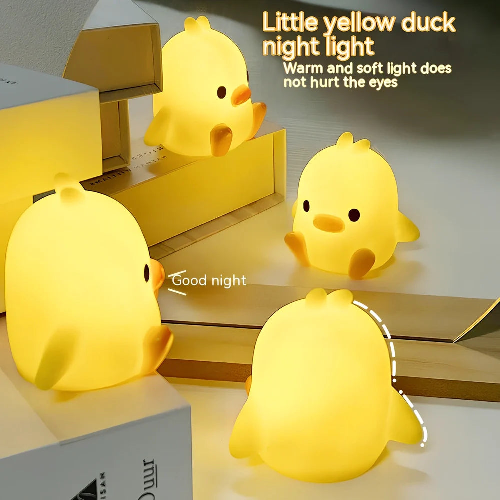 Small yellow duck-shaped night lamp measuring 6cm tall with warm LED light