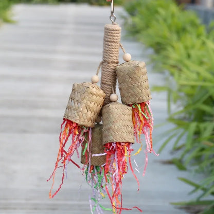 Wooden parrot chew toy with colourful shredded paper measuring 15x35cm
