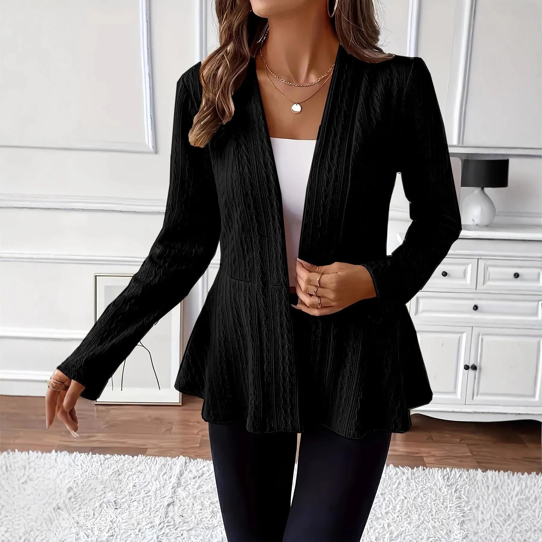Women's apricot coloured knitted cardigan with jacquard pattern and one button front closure.