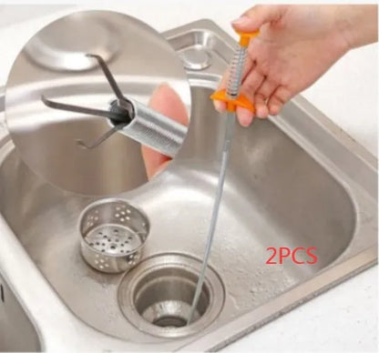 Stainless steel sewer dredge spring drain cleaning tool with a black PP handle.