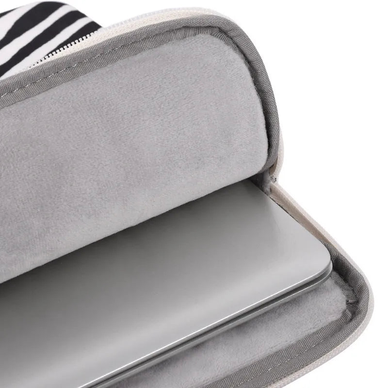 Black and white zebra pattern polyester protective sleeve for a digital notebook, available in 11 to 17 inch sizes