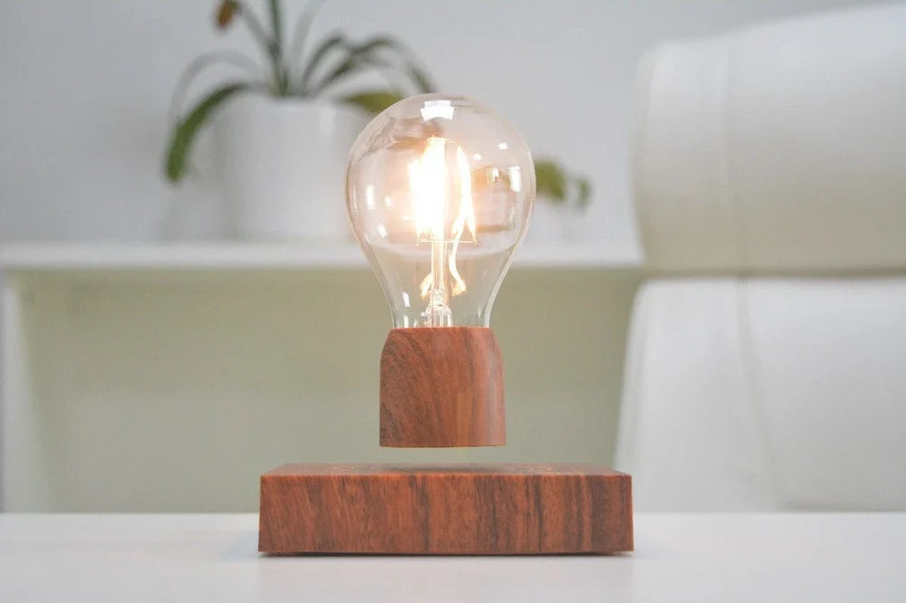 Magnetic levitation bulb floating above imitation wood base with international plug options