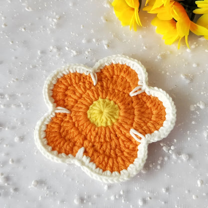 Five handmade woven flower placemats in blue, green, orange, pink and purple colours