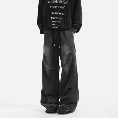 Men's cotton straight-leg sweatpants in black and gray with pleated washed finish and elastic waist