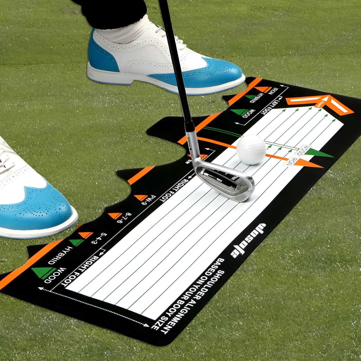 Black neoprene golf swing posture pad with directional markings on a green surface.