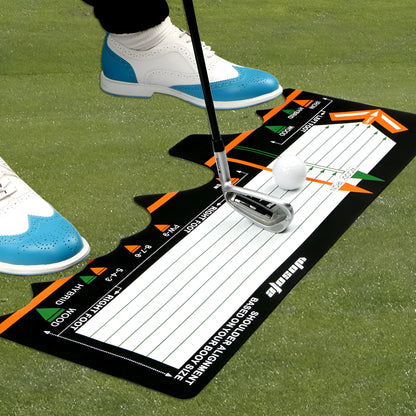 Black neoprene golf swing posture pad with directional markings on a green surface.
