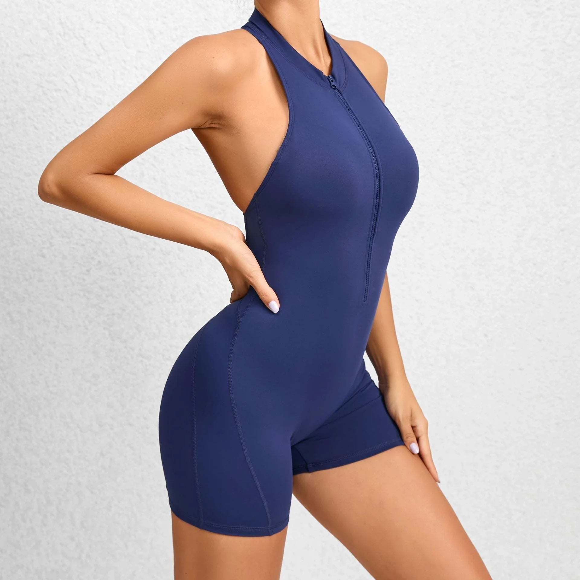Women's sleeveless tummy control shapewear jumpsuit with zipper closure, available in multiple colors and sizes
