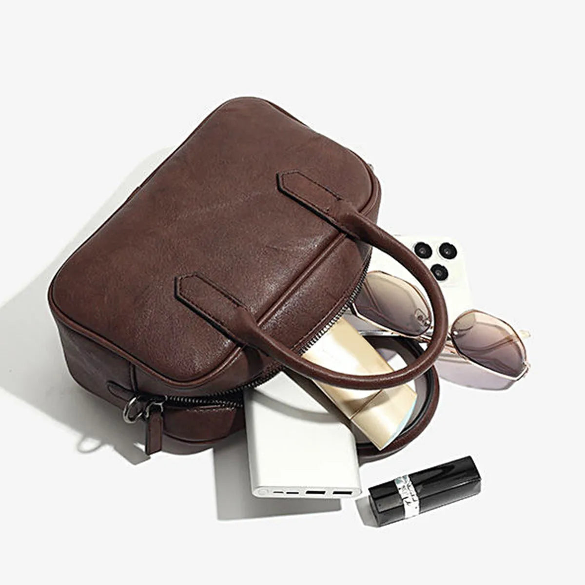 Retro square PU leather messenger bag with an adjustable shoulder strap in black colour.