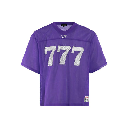 Man wearing a loose-fit purple retro t-shirt on a casual summer day.