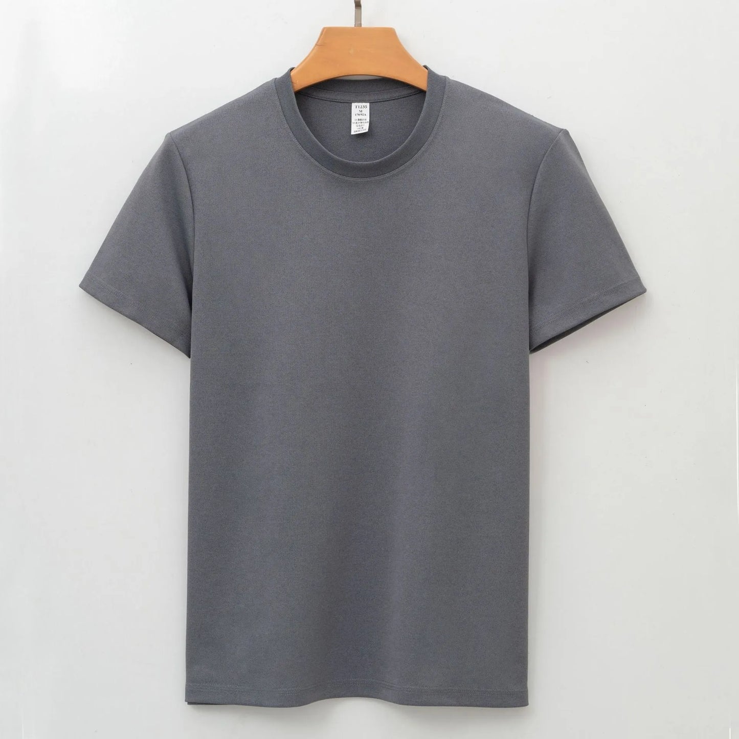 Men's solid colour antibacterial quick-dry short sleeve T-shirt on a hanger.
