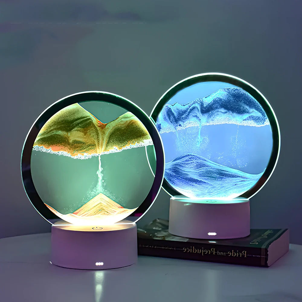Desktop hourglass lamp with colourful LED lighting illuminating flowing quicksand patterns