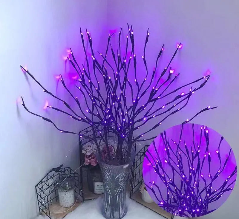 Silver branch LED tree light in a vase with multiple colour change modes including blue, pink, and warm white.