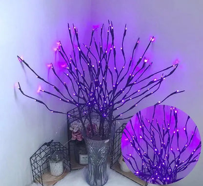 Silver branch LED tree light in a vase with multiple colour change modes including blue, pink, and warm white.