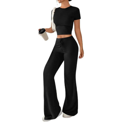 Black high waist trousers and regular sleeve t-shirt suit set on a model, showing the coordinated two-piece outfit
