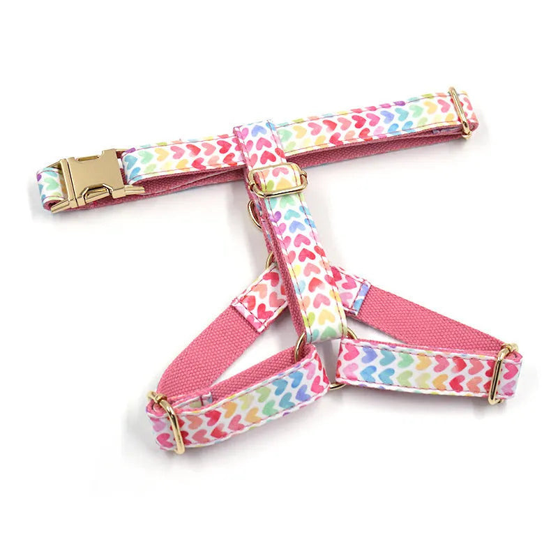 Pink colourful dog harness with heart-shaped stones and gold buckle in chest and back strap design