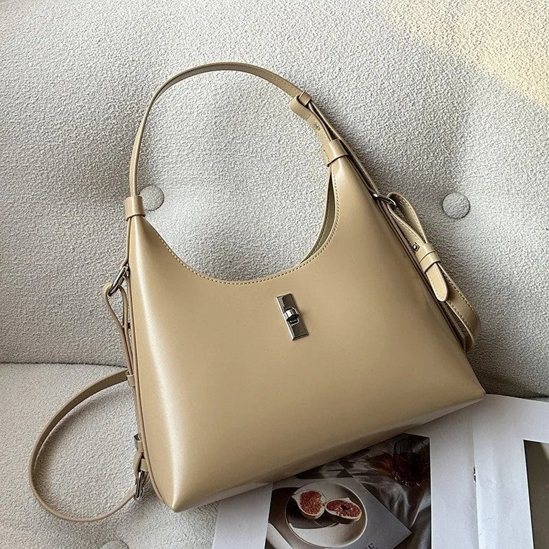 Dumpling-shaped genuine leather crossbody shoulder bag for women and men, made from soft first layer cowhide with sandwich pocket design, featuring zipper change compartment and mobile phone pocket in apricot, black, brown, light blue, red or white