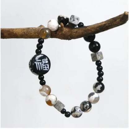Hand-woven natural black agate ceramic bracelet with geometric design and round elements