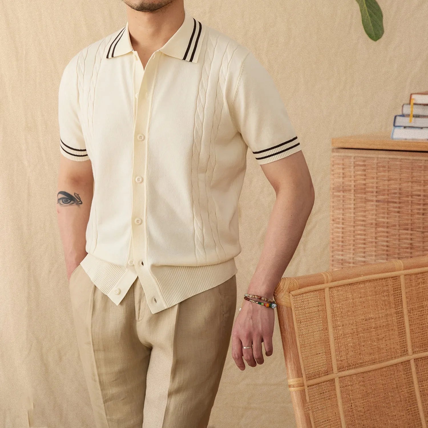 Casual apricot coloured lapel collar polo shirt made from thin cotton blend fabric on a hanger.