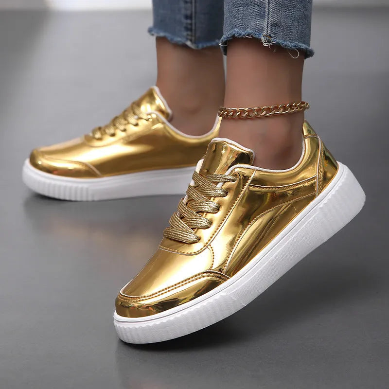 Rose gold and gold sequin platform sneakers with thick soles and round toe on a white background.