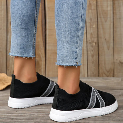Black women's flyknit mesh flat shoes with rubber sole and tassel detail