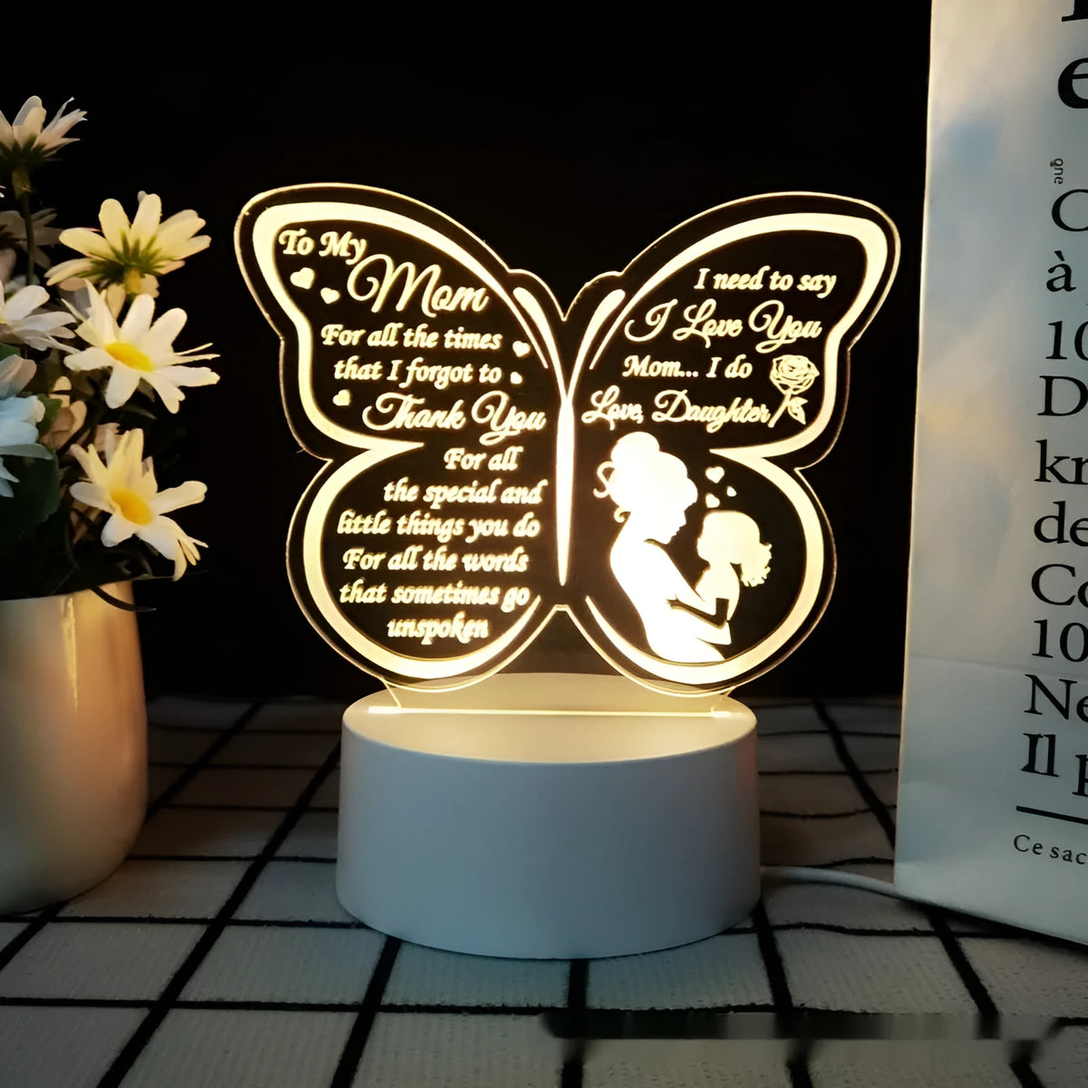 White heart-shaped touch control table lamp on a wooden desk.