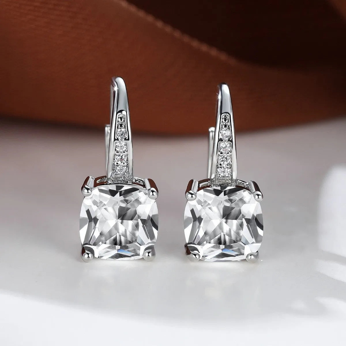 Square zircon inlaid ear hook earrings with geometric design and electroplated finish in golden tone