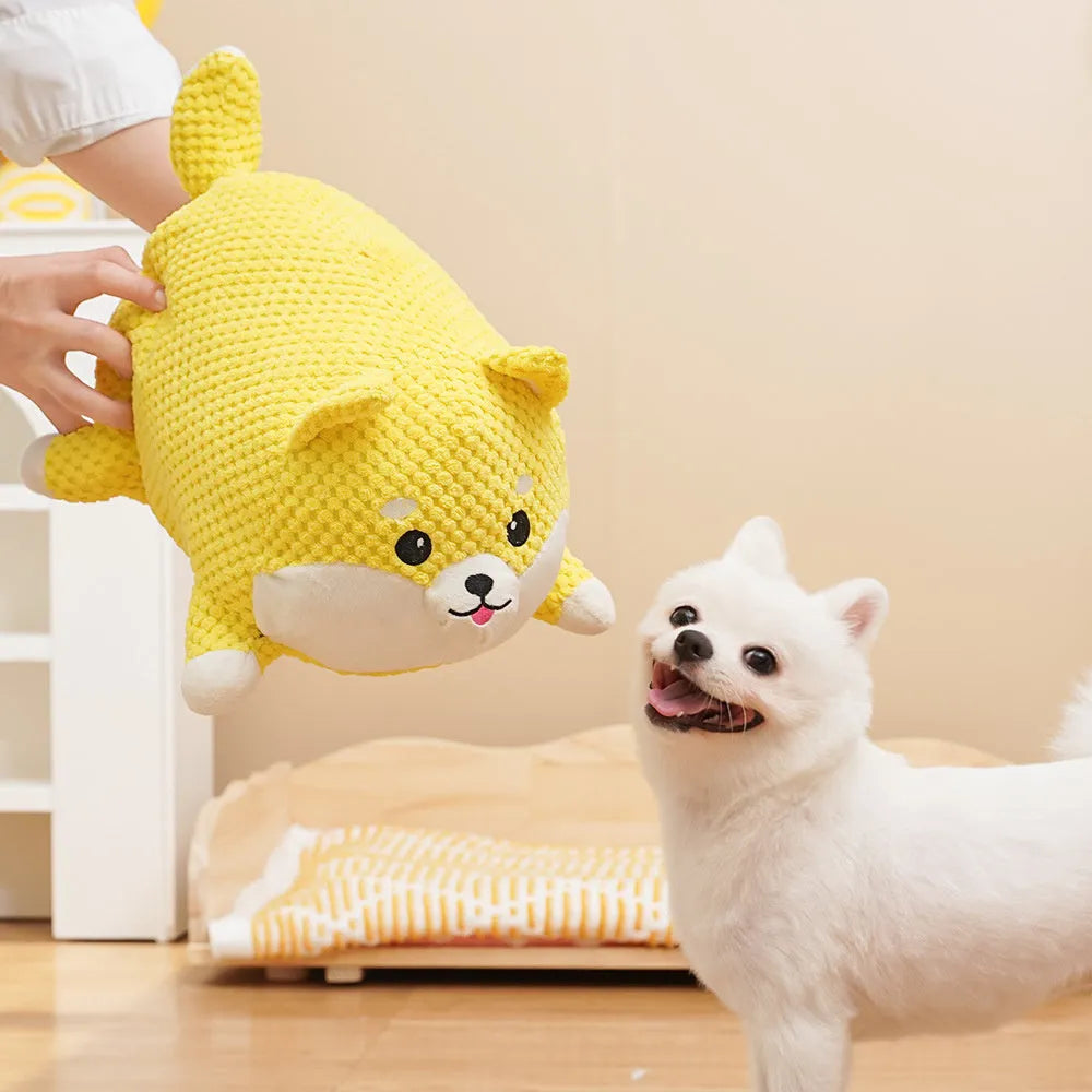 Calming plush dog toy with teeth cleaning chew surface and squeaker