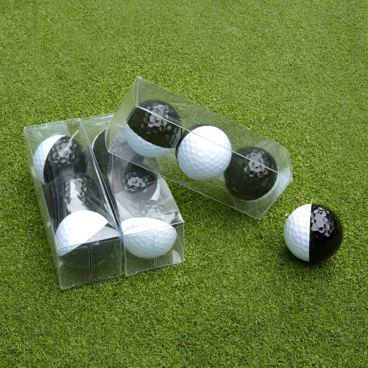 Two-tone black and white golf practice ball, 42mm, titanium sarin housing, soft rubber core, 3 per box